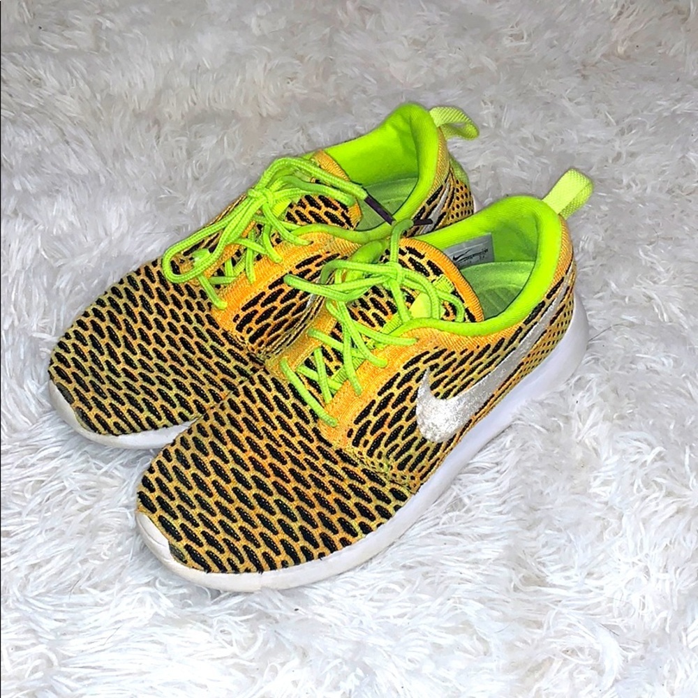 - Nike Roshe One Flyknit Women’s Voltage Sneakers​